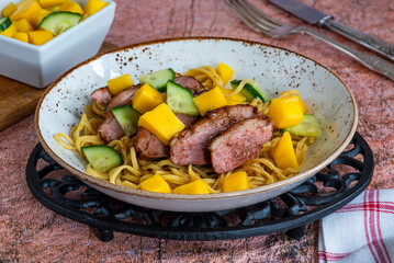 Hoisin duck with egg noodles and mango