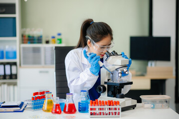 Discover a dedicated scientist conducting laboratory research, using pipettes, microscopes, and lab...