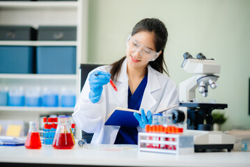 Discover a dedicated scientist conducting laboratory research, using pipettes, microscopes, and lab...