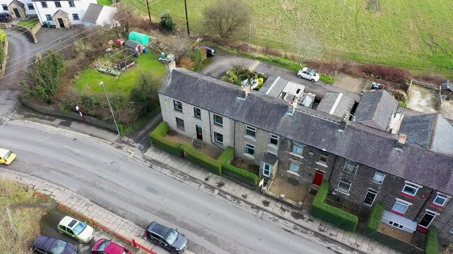 Aerial footage of the town of Thornhill Edgein Dewsbury West Yorkshire in the UK showing the British town from above and rows of traditional terrace houses in the winter time