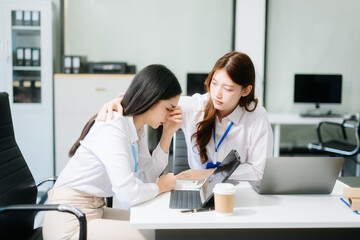 Furious two Asian businesspeople arguing strongly after making a mistake at work