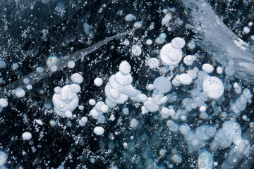 Gas methane bubbles frozen in blue ice of lake Baikal