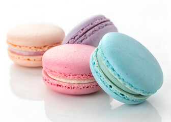 A delicious selection of pastel-colored French macarons, showcasing their light and airy texture on a bright white background.