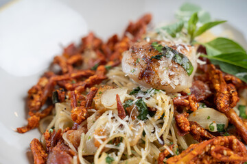 Delicious seafood pasta dish with crispy garnish restaurant photography