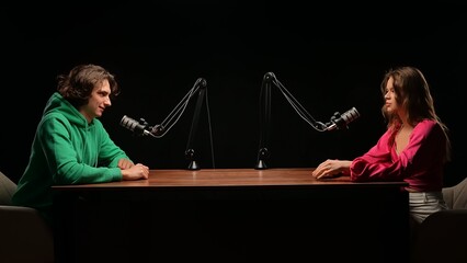 Engaging Discussion Unfolds in a Cozy Podcast Studio With Two Passionate Storytellers