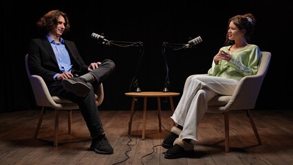 Engaging Conversation Between Influencers in a Cozy Recording Studio Setting
