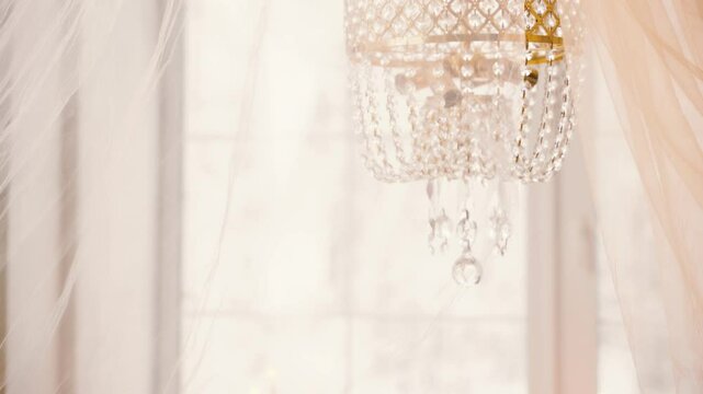 sexy girl princess lying down on bed. lady fashion model posing. crystal chandelier window roses flowers in vases candles medieval atmosphere. Fantasy woman queen, white room old style vintage dress