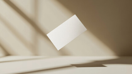 Floating white business card on a soft beige background with gentle shadows