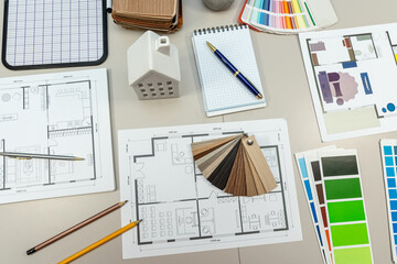 house model placed on meeting table with house model, interior design by using color palette