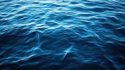 Obraz premium A tranquil scene of ocean water with slight waves, creating calm, soothing patterns in the deep blue sea.