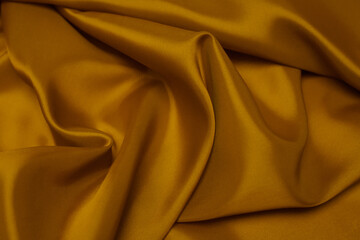 Golden satin wavy background/texture
