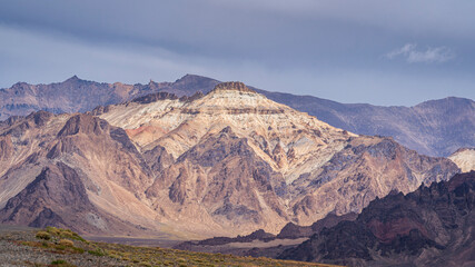 Colorful landscape view of purple pink mountain in high altitude desert along Pamir Highway on...