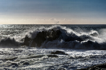 waves crashing on rocks