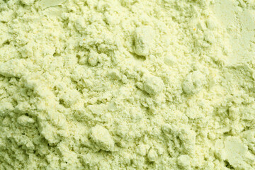 Dry wasabi powder as background, above view