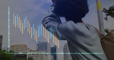 Image of financial data processing over african american woman waving on street