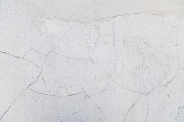 Light cracked wall. Minimalistic soft wall texture with cracked details.