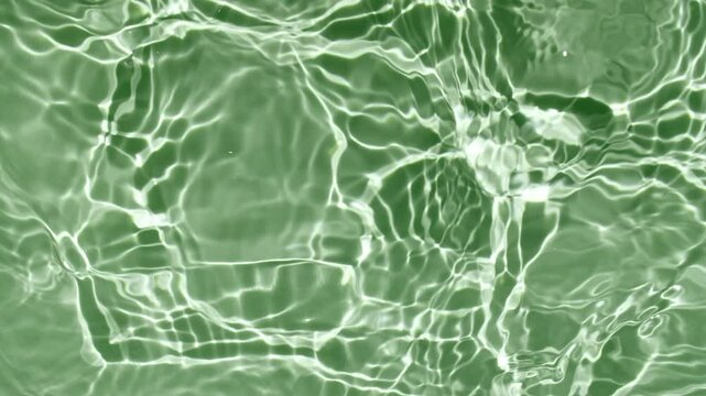 Green water texture with waves. Organic shadow effect with wave refraction of light. Slow motion . High quality 4k footage