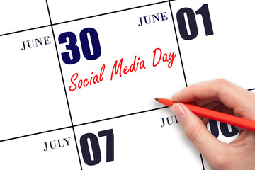 June 30. Hand writing text Social Media Day on calendar date. Save the date. Holiday. Day of the year concept.