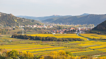 Naklejka premium Durnstein in the Wachau winery region in Austria. Danube Valley in autumn colors. Idyllic landscape and famous tourist destination.