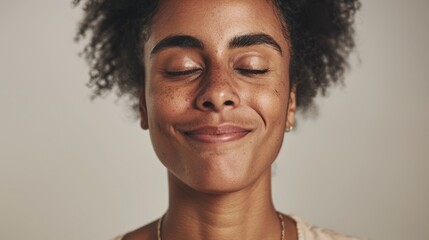 The image features a person, specifically a young adult woman, captured in a candid moment of contentment or relaxation.