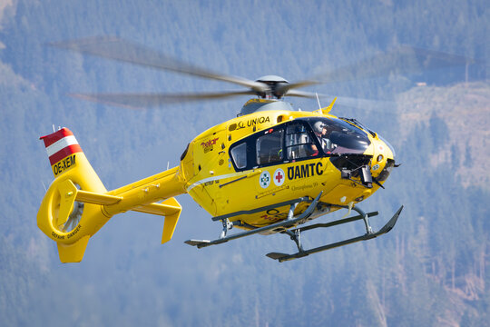 Zeltweg, Austria - September 7, 2024: Rescue helicopter of austrian organisation OEAMTC, &Ouml;AMTC coming in for landing at an emergency scene