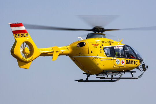 Zeltweg, Austria - September 7, 2024: Rescue helicopter of austrian organisation OEAMTC, &Ouml;AMTC coming in for landing at an emergency scene