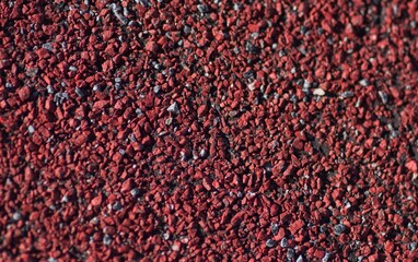 Close up of a red roof shingle