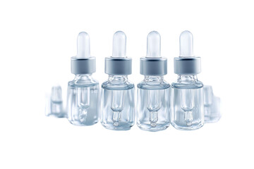 Group of glass dropper bottles with transparent liquid isolated on a transparent background. The bottles are filled with clear liquid