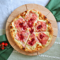 top view of pizza with ham, lingonberry, cheese, tomatoes, copy space, moc up