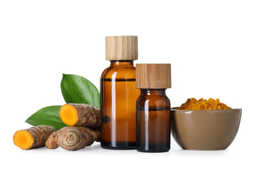Bottles of turmeric essential oil, powder, raw roots and leaves isolated on white