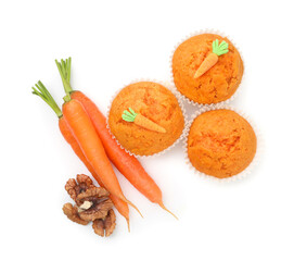 Tasty carrot muffins, walnuts and fresh vegetables isolated on white, top view
