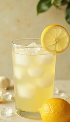 Refreshing glass of lemonade with ice cubes and lemon slice garnish. Perfect for hot summer days. Food and beverage advertisements, summer promotions, and recipe blogs.