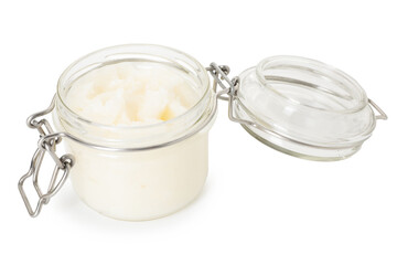 Organic coconut cooking oil in glass jar isolated on white