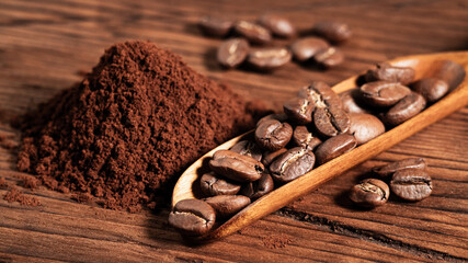 Arabica Coffee Beans Maragogipe on a Wooden Background. Elephant Beans with Ground Coffee