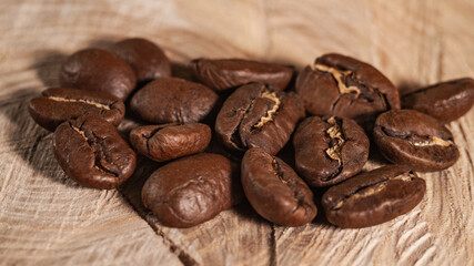 Arabica Coffee Beans Maragogipe on a Wooden Background. Elephant Beans