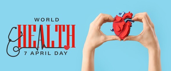 Hands with paper heart on light blue background. Banner for World Health Day