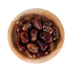 Dates fruit served on wooden plate