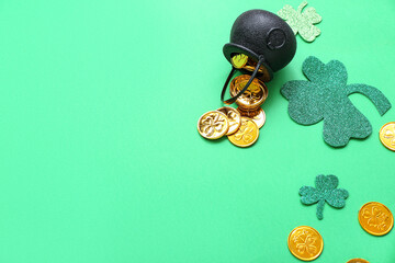 Pot with coins and paper clovers on green background. St. Patrick's Day celebration
