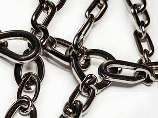 Fototapeta premium Intertwined Steel: A close-up of a complex pattern formed by the links of a robust steel chain, showcasing its industrial strength and intricate design.