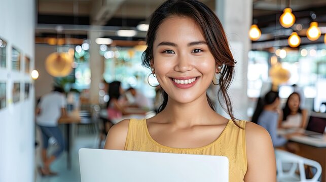 Confident female professional smiling modern office portrait image bright setting engaging concept
