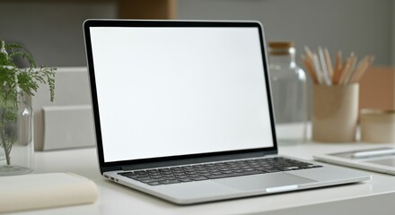 Modern laptop on a clean desk with copyspace for design elements