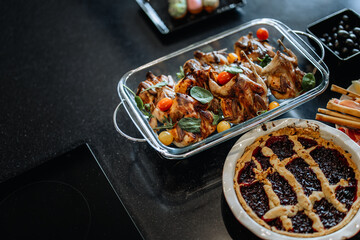 Roasted Chicken and Lattice Pie on Dark Countertop