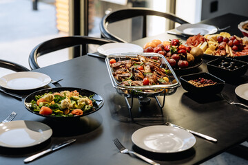 Elegant Dining Table with Grilled Meats and Fresh Salads