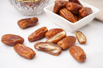 Dried dates on light background