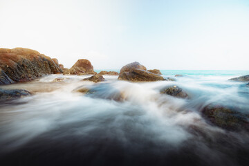 Ethereal Seascape with Flowing Waves Over Coastal Rocks - High Resolution Image of a beach of Sri Lanka 