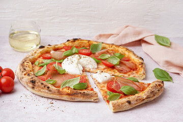 Tasty pizza with Burrata cheese on light background