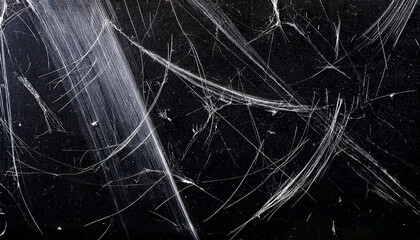 white dust and scratches on a black background the texture of dirt on the glass