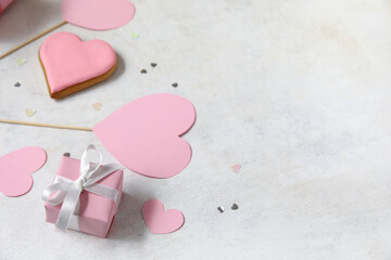 Gift box and heart shaped sweet cookie on white background. Valentine's Day celebration