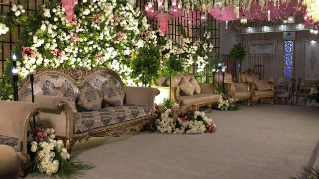 Beautiful Wedding Stage with Golden Sofas, Pink & White Flowers, and Magical Lighting | Cinematic Backward Glide