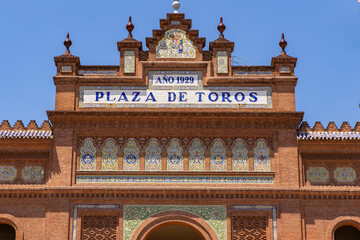 Obraz premium Las Ventas bullring, Madrid, Bull square. Plaza de toros. Events and traditions of Spain. Red sand under a burning sun. No people. Fight between matador and bull. Blood, passion, dance, celebration.